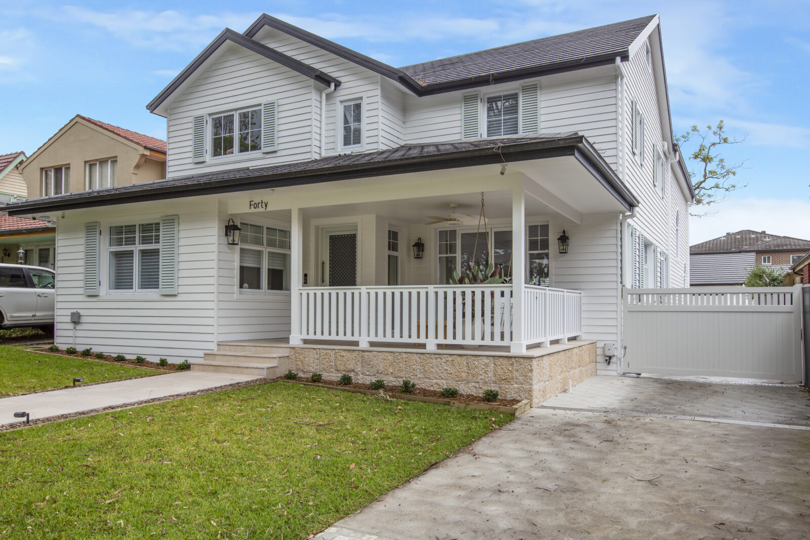 Hamptons-style weatherboard new build with front verandah