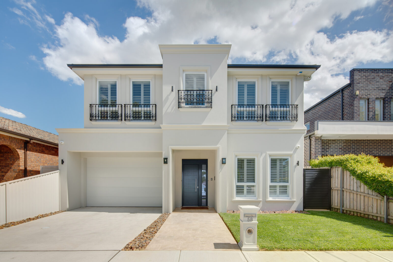 French-provincial facade of the Mascot home by Construction by SM